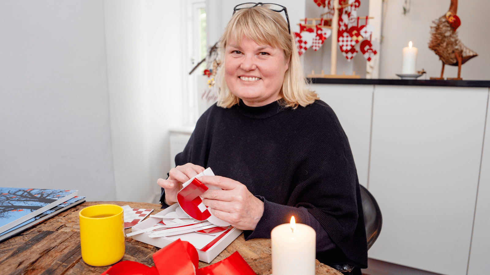 Rikke V. Stoltz hosting private Danish paper heart weaving experience in Copenhagen home