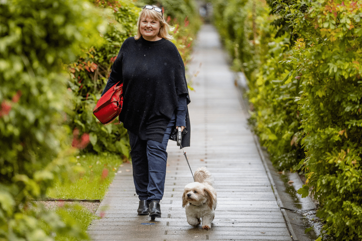 Rikke Stoltz walking in private green courtyard Frederiksberg Copenhagen authentic local experience