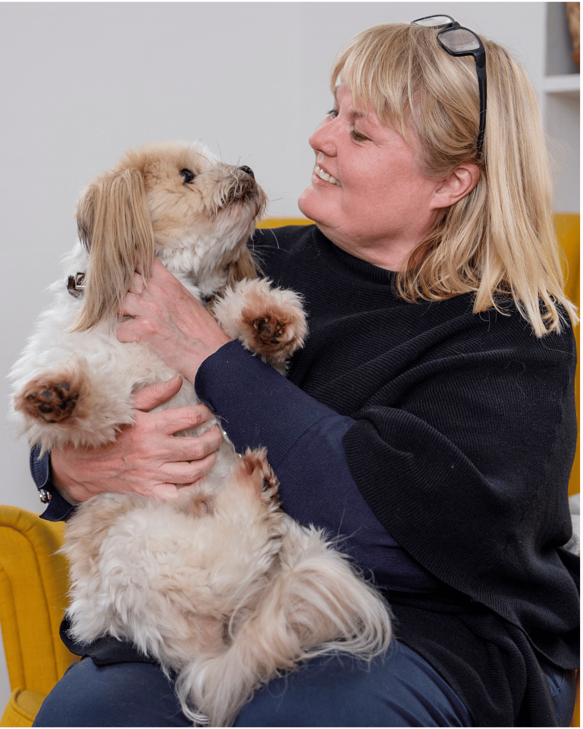 Rikke Stoltz with her small fluffy dog Felix in cozy Danish home Frederiksberg